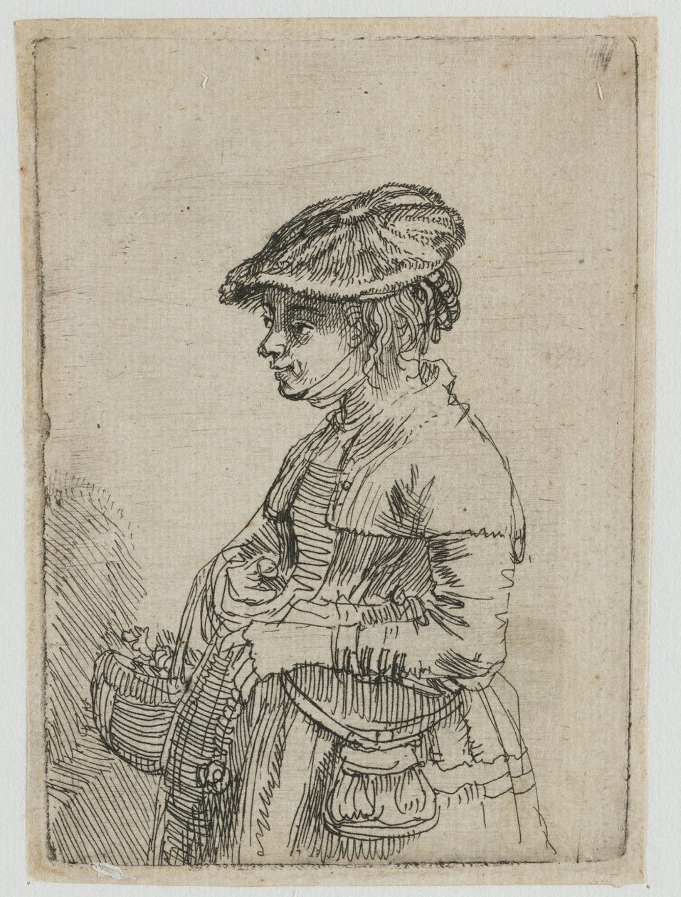 Tyttö korin kanssa tekijältä Rembrandt van Rijn