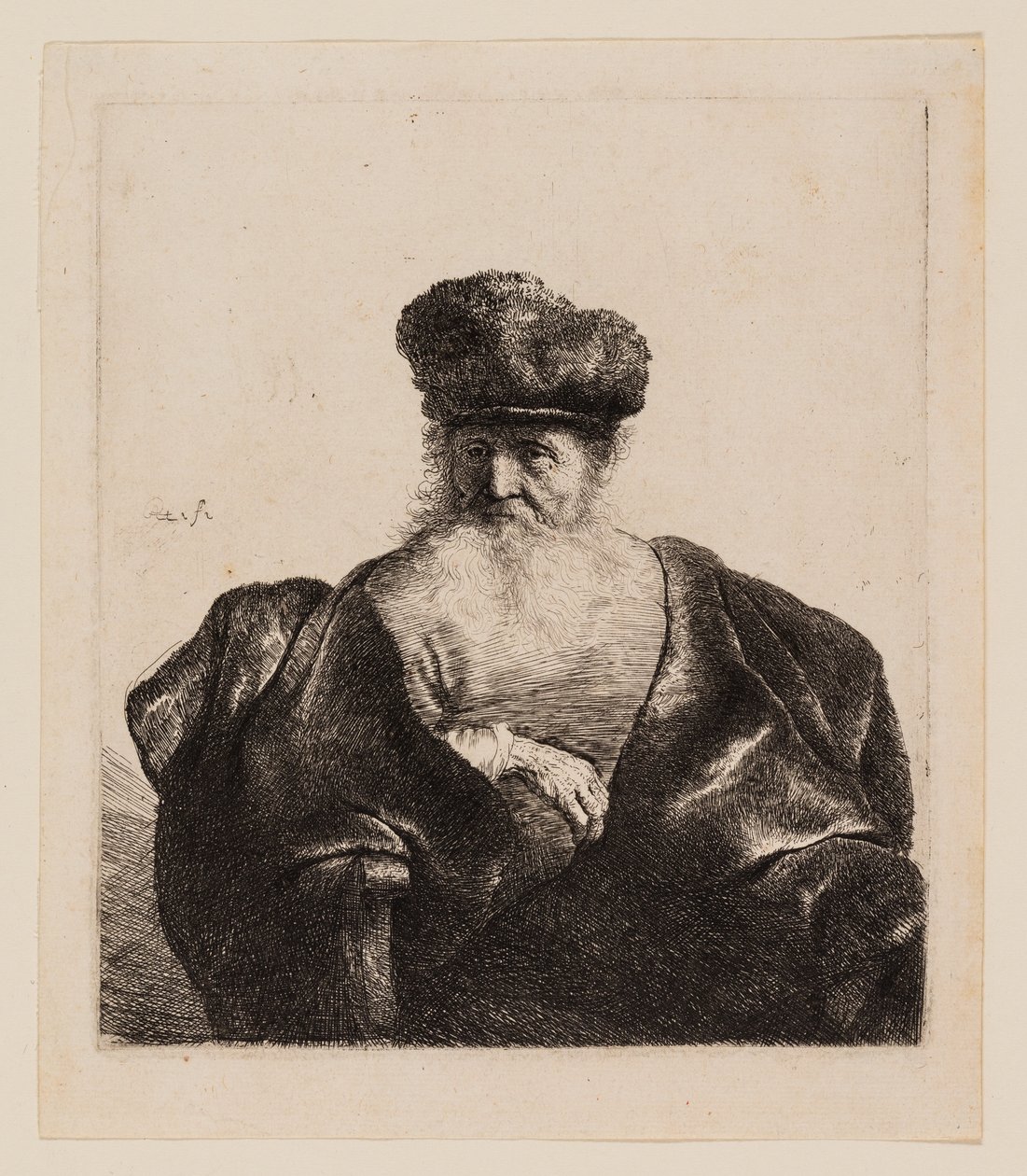 Vanha mies, jolla on parta, turkislakka ja samettiviitta tekijältä Rembrandt van Rijn