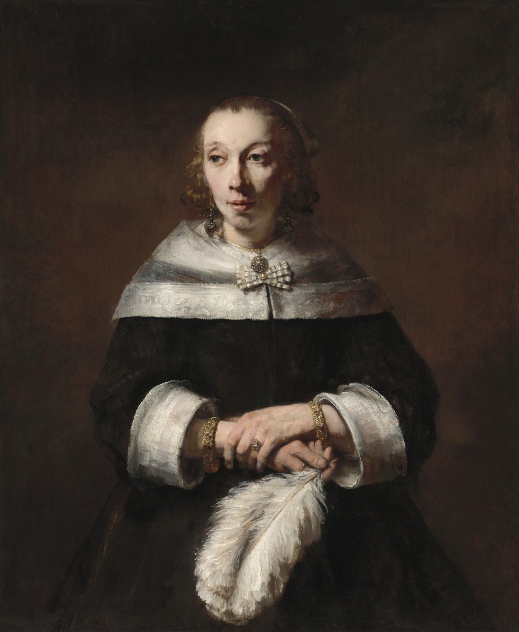 Muotokuva naisesta, jolla on strutsiviuhka tekijältä Rembrandt van Rijn