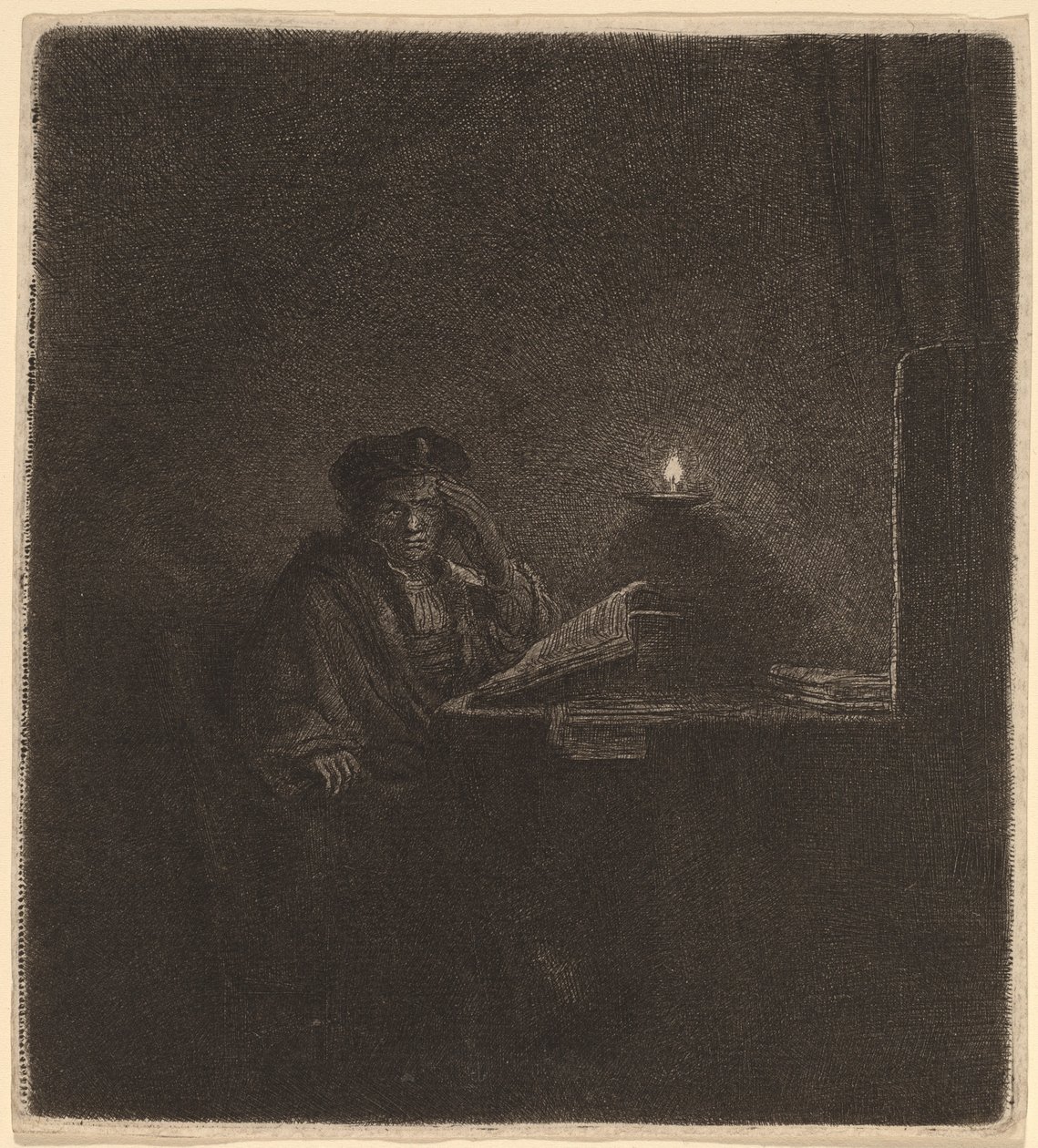 Opiskelija pöydän ääressä kynttilänvalossa tekijältä Rembrandt van Rijn