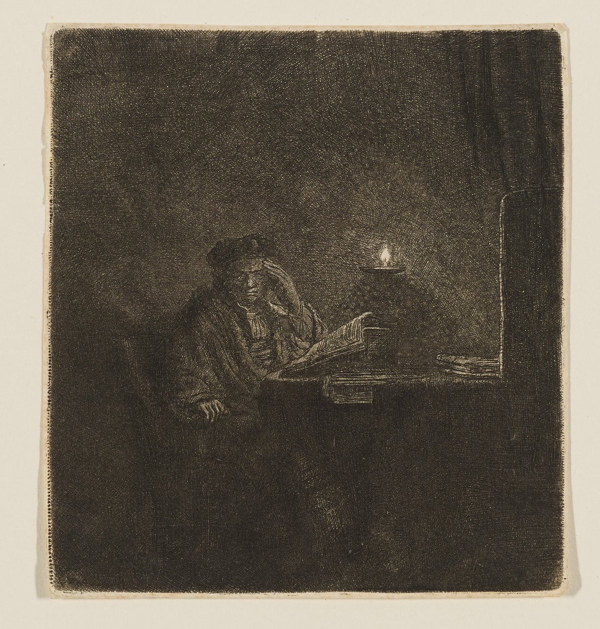 Opiskelija pöydän ääressä kynttilänvalossa tekijältä Rembrandt van Rijn