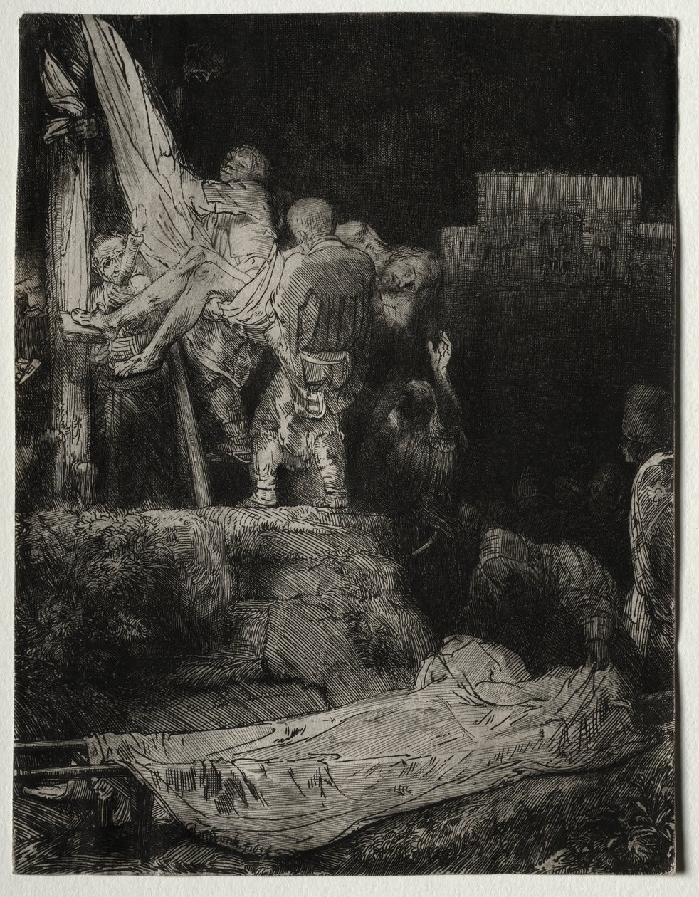 Laskeutuminen ristiltä soihdunvalossa tekijältä Rembrandt van Rijn