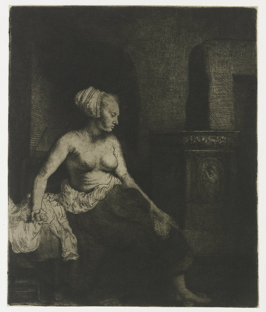 Nainen istuu puolipukeutuneena lieden vieressä Nainen istuu puolipukeutuneena lieden vieressä tekijältä Rembrandt van Rijn