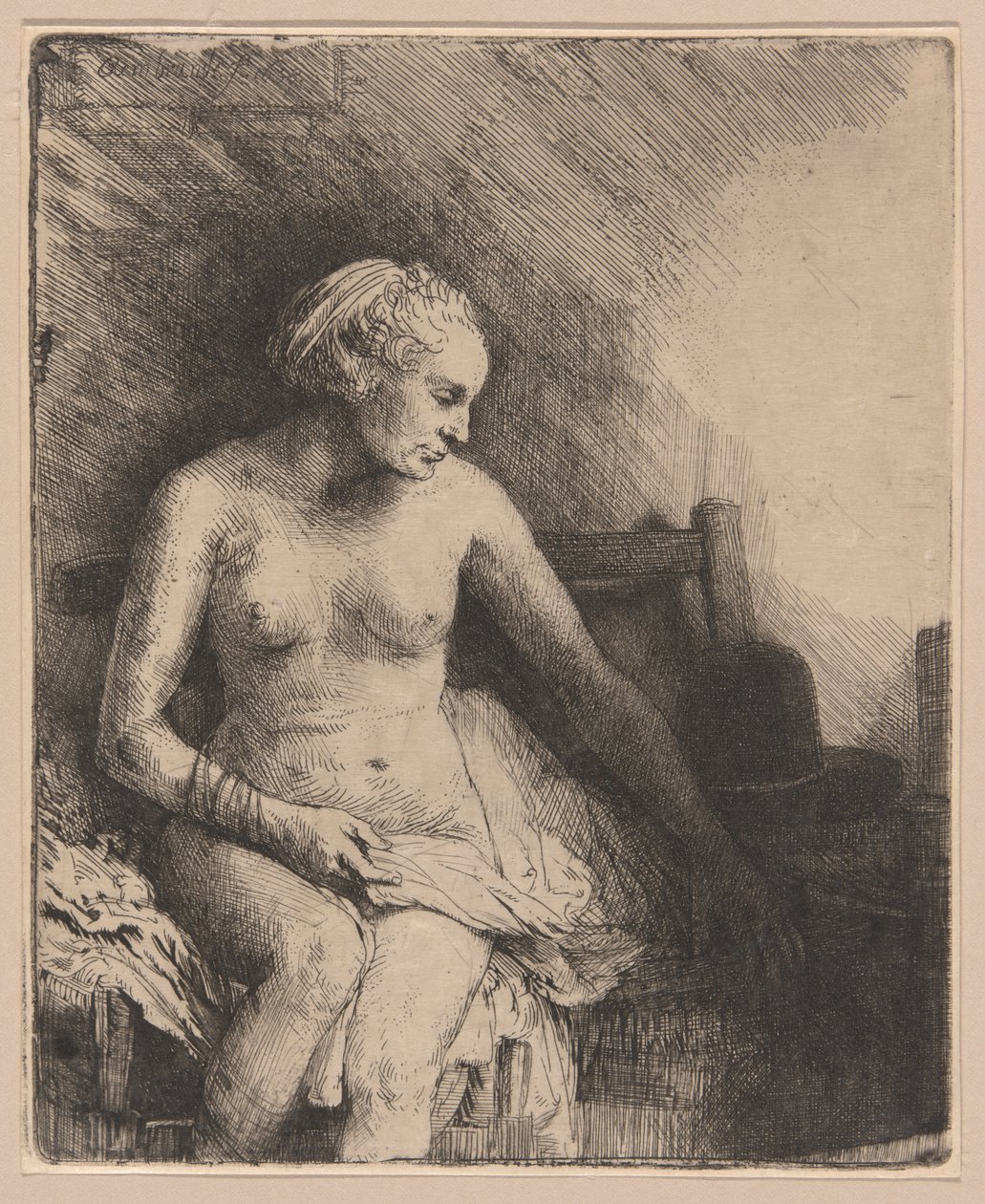 Nainen kylpylässä hattu vieressään tekijältä Rembrandt van Rijn