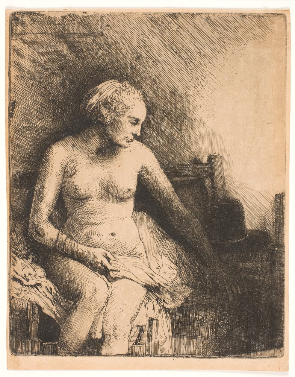 Nainen kylvyssä, hattu vieressään tekijältä Rembrandt van Rijn