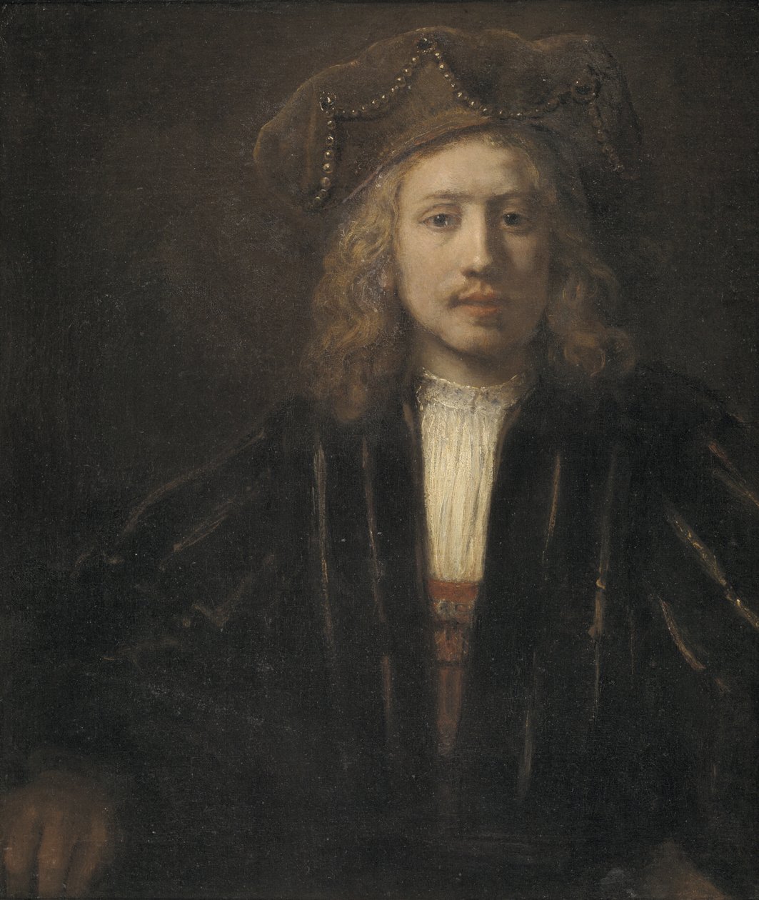 Nuori mies helmikoristeisessa lippiksessä tekijältä Rembrandt van Rijn