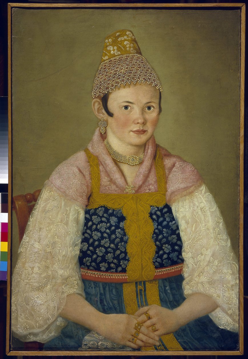 Kauppiaan vaimon muotokuva, perinteisen kokoshnikin päähine. (Muotokuva kauppiasnaisesta Kokoshnik Kabluchokissa). Hän käyttää myös perinteistä venäläistä mekkoa (sarafanea), jossa on koruompelukset, pitsihihainen pusero, päähine tekijältä School Russian