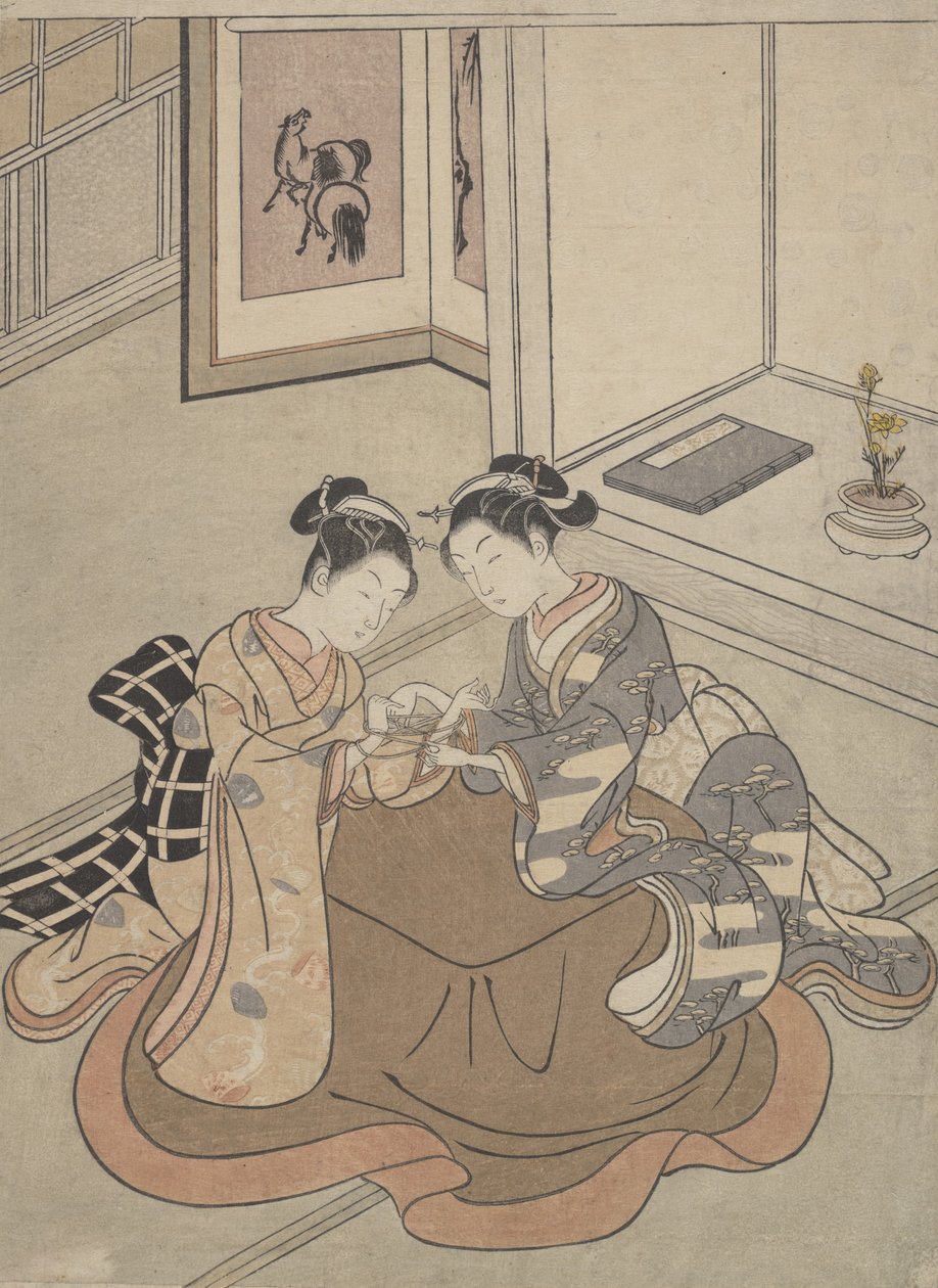 Kaksi nuorta naista istuvat Kotatsu Playing Cat