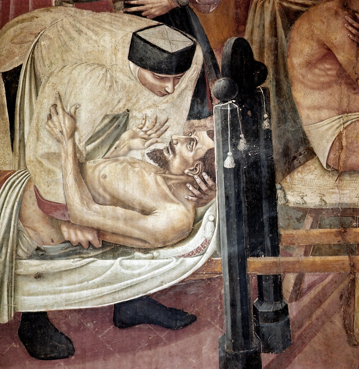 Sairaanhoito sairaalassa, sairaanhoitaja auttaa paareilla makaavaa loukkaantunutta”” Yksityiskohta. Fresko Taddeo di Bartolo (1363-1422) 1300-luvun Siena, Spedale di Santa Maria della Scala tekijältä Taddeo di Bartolo