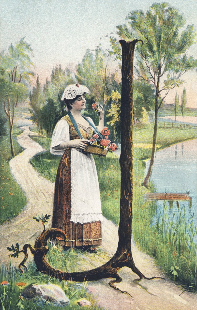 J: Pitkässä hameessa, esiliinassa ja liivissä seisova nainen kantaa kukkakoria. Maalaissisustus - Aakkosmerkit Ref Th. E., L. Theochrom - Serie 994. Theodor Eisman, kustantaja, Leipzig tekijältä Unbekannt