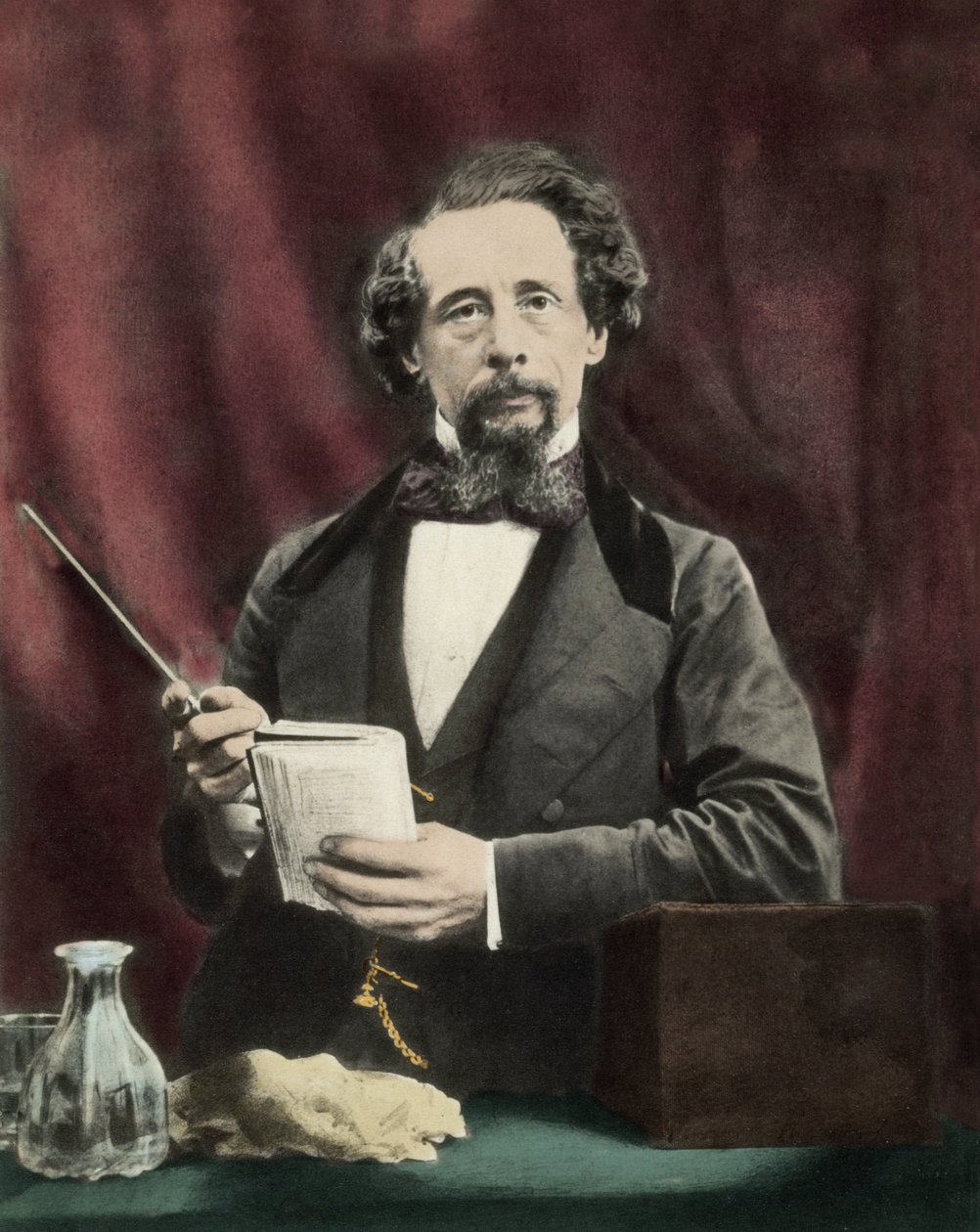 Charles Dickens (1812-1870) lukemassa noin 1860. tekijältä Unknown artist