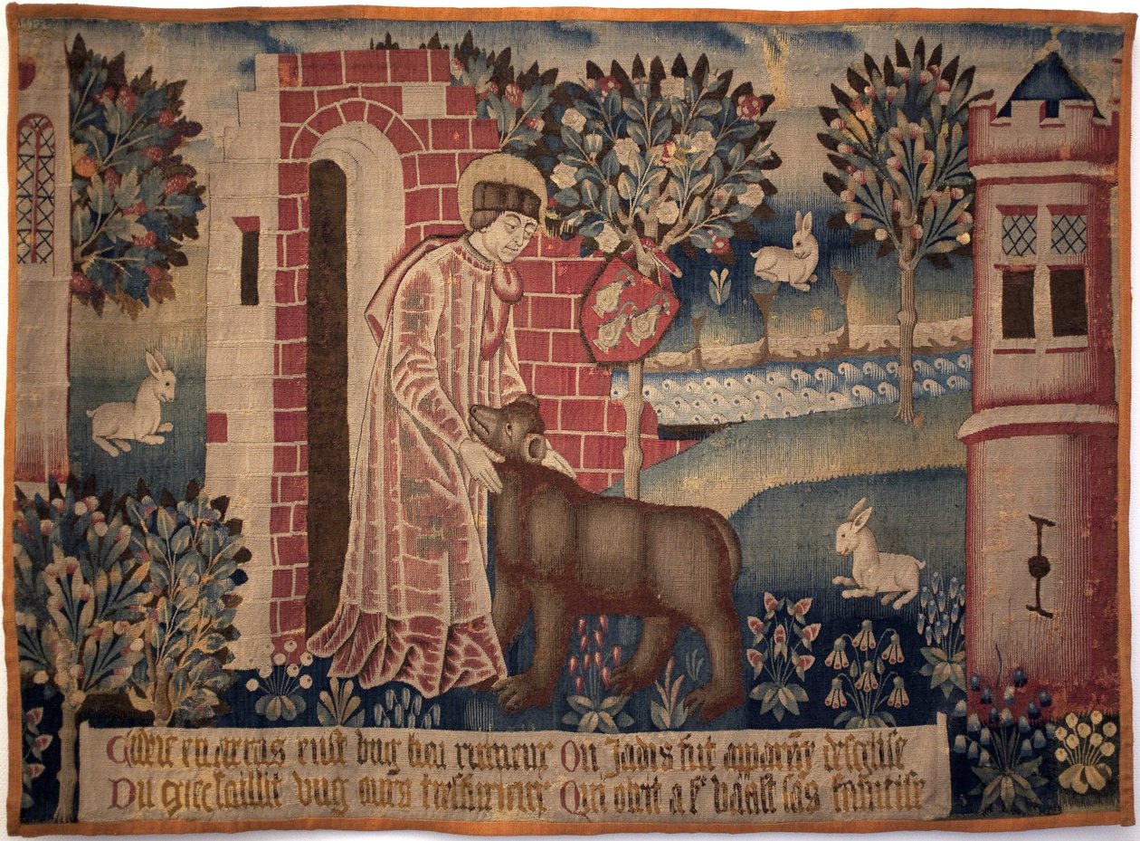 Pyhä Vaast ja karhu. Saint Vaast, Saint Vedast tai Saint Gaston (kuoli vuonna 540, eveque ja Arrasin ja hänen hiippakuntansa suojeluspyhimys) kesyttää eläimen Crinchon-joen rannalla. Kuvakudos, 1400-luvun toinen puoli. Arrasin taidemuseo tekijältä Unknown artist
