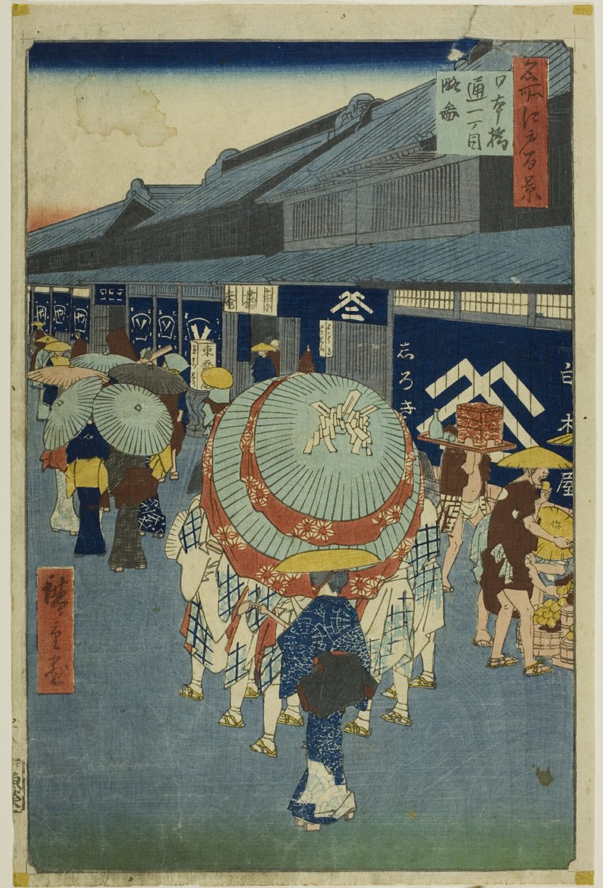 Näkymä Nihonbashi Tori-itchomeen (Nihonbashi Tori-itchome ryakuzu), sarjasta "Sata kuuluisaa näkymää Edosta (Meisho Edo hyakkei)". tekijältä Utagawa Hiroshige