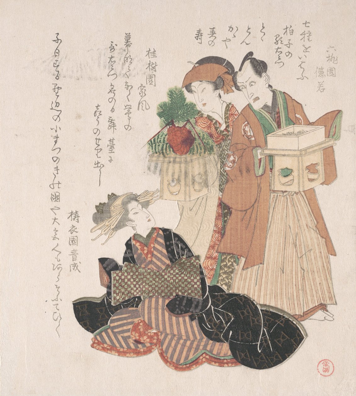 Näyttelijä Nakamura Utaemon kahden naisen kanssa valmistautumassa uudenvuoden seremoniaan, 1800-luku. tekijältä Utagawa Toyokuni I