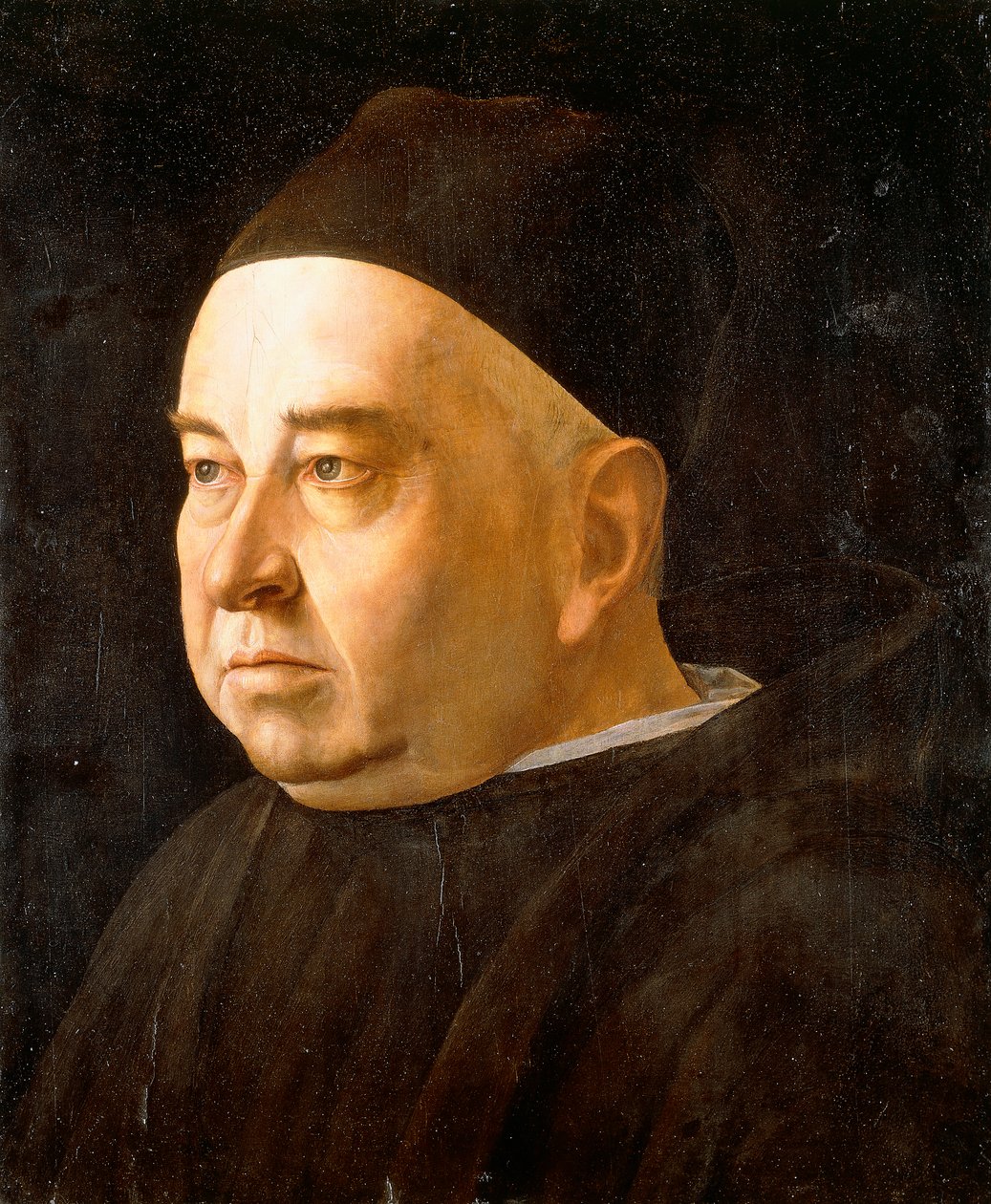 Muotokuva pappilta, rintaan asti, yllään musta takki ja lippalakki, n. 1490 tekijältä Venetian School