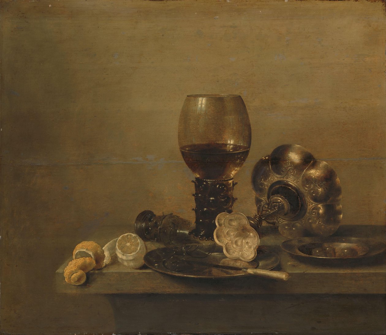 Asetelma rikkoutuneen lasin kanssa tekijältä Willem Claesz. Heda