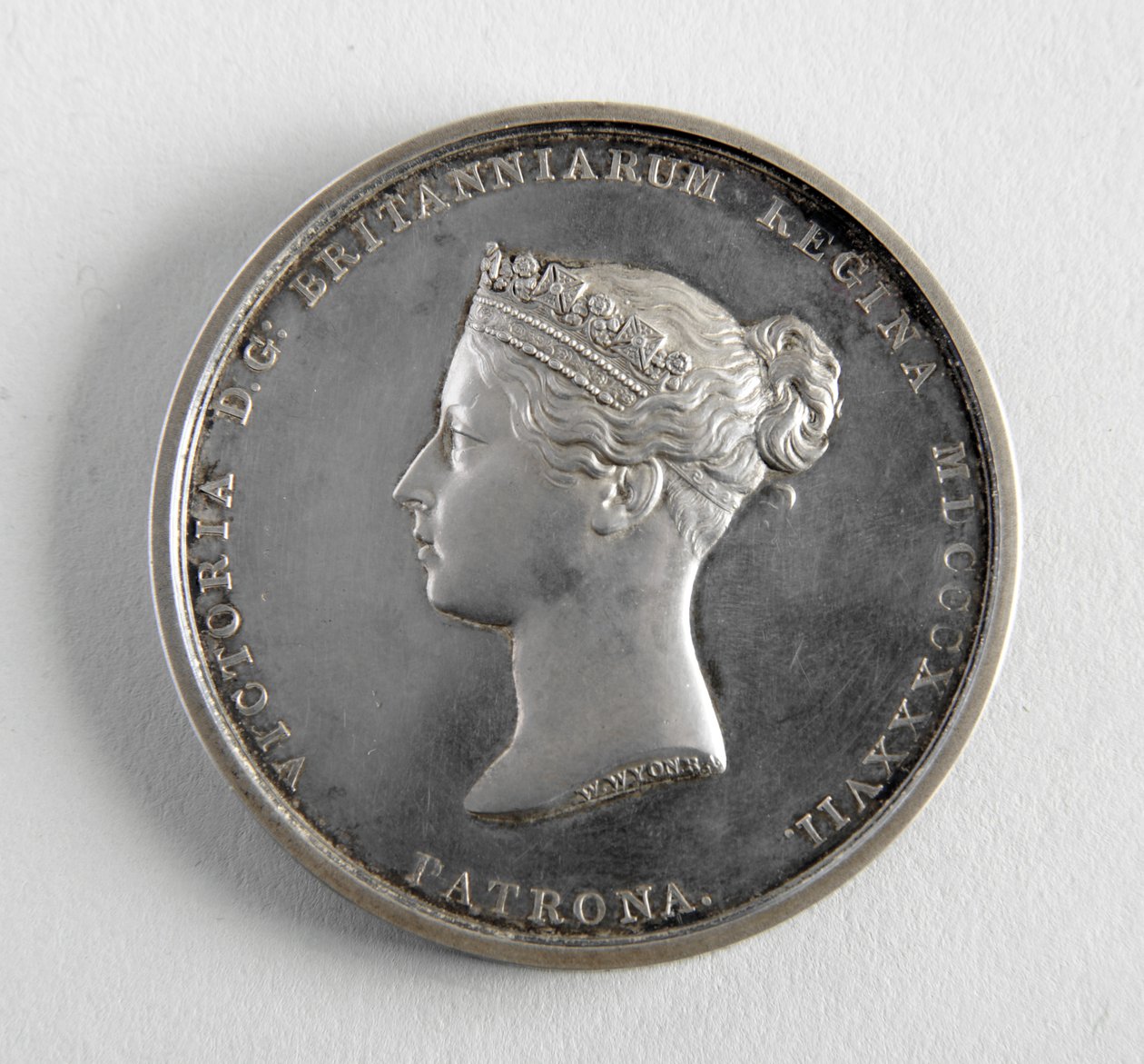 R.A. mitali myönnettiin George Framptonille 10.12.1884 parhaasta figuurimallista (metalli) tekijältä William Wyon