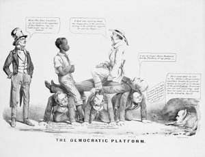 "The Democratic Platform" poliittinen sarjakuva, joka kommentoi demokraattisen puolueen asemaa orjuudessa, n. 1856 tekijältä American School