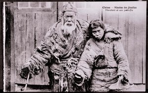 Vanha kerjäläinen pojanpojan kanssa Valokuva 1900-luvun alusta - Yksityiskokoelma tekijältä Anonymous Anonymous