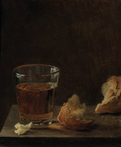 Lasi olutta ja sämpylä pöydällä