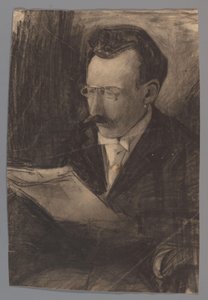 Miehen muotokuva lukemassa