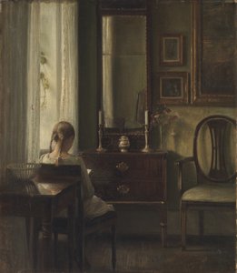 Sisustus, jossa tyttö lukee tekijältä Carl Holsoe