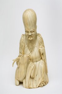 Shou Xingin kaiverrettu norsunluuhahmo istuu peuran kanssa, n. 1580-1644 tekijältä Chinese School