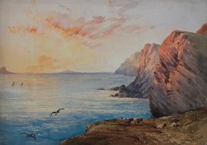Dorsetin rannikko auringonlaskun aikaan