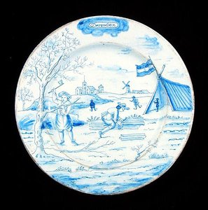 Joulukuuta esittävä Delftware-laatta (tinalasitettua saviastiaa). tekijältä Dutch School
