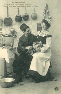 Palvelijatyttö istuu miehen polvella keittiössä tekijältä French Photographer