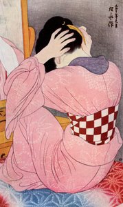 Japanilainen nainen pukemassa hiuksiaan, 1920-luku 1930.