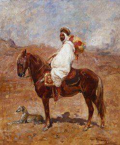 Arabi hevosen selässä aavikkomaisemassa
