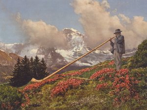 Sveitsi: Alphorn Blower, Jungfrau taustalla (värikuva)