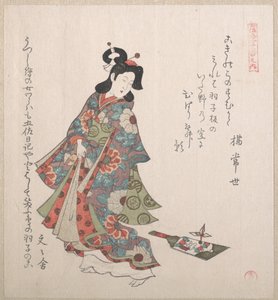 Tyttö ja hagoita (japanilainen sulkapallomaila ja sulkapallo)