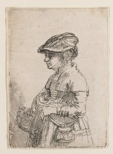 Tyttö korin kanssa tekijältä Rembrandt van Rijn