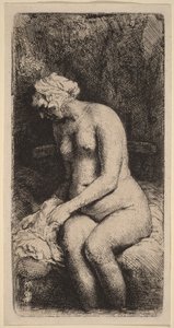 Alaston nainen istuu penkillä tyynyn kanssa (nainen pesee jalkojaan purossa) tekijältä Rembrandt van Rijn