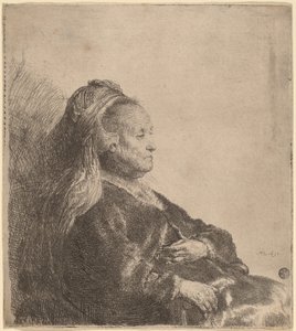 Taiteilijan äiti istuu itämaisessa päähineessä tekijältä Rembrandt van Rijn