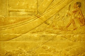 Muinainen Egypti, Seinän kaiverrus/maalaus, Mastaba/Idoutin hauta, Saqqara, 2323-2150 eKr., Kalastaja, joka suippaa kaloja ja pitelee nelihaaraista keihästä (kuva) tekijältä School Egyptian