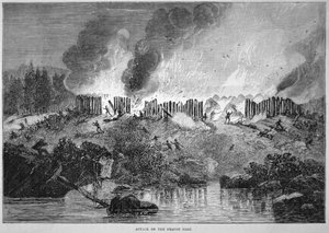 Uuden-Englannin valkoiset uudisasukkaat hyökkäävät Pequotin intiaanilinnoitusta vastaan vuoden 1637 Pequot-sodan aikana (kaiverrus)