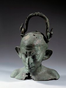 Pronssipään muotoinen maljakko: Syyrialaisen orjan (?) rintakuva. 2. tai 3. vuosisadalla JC:n jälkeen. Aurinko 0,19 m Pariisi, Musee du Louvre