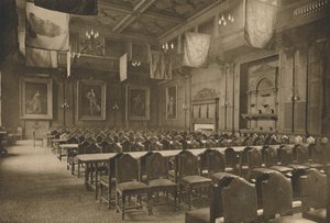 Lippuriippuva suuri sali, jossa voimakas elintarvikekauppiaiden yritys pitää juhlansa, vuodelta 1935. tekijältä Unbekannt