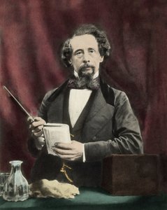 Charles Dickens (1812-1870) lukemassa noin 1860. tekijältä Unknown artist