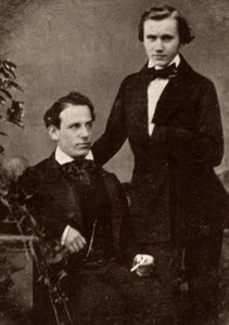 Johannes Brahms (1833-1897) saksalainen säveltäjä, seisoo, ja pakolainen unkarilainen viulisti Eduard Remenyi (1828-1898), jonka kanssa hän lähti kiertueelle (puolikuva valokuvasta). tekijältä Unknown photographer