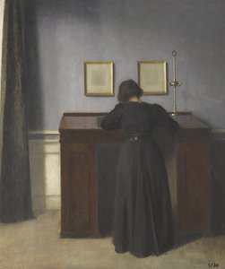 Ida seisoo pöydän ääressä tekijältä Vilhelm Hammershøi