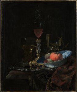 Viinilasi ja kulhollinen hedelmiä tekijältä Willem Kalf