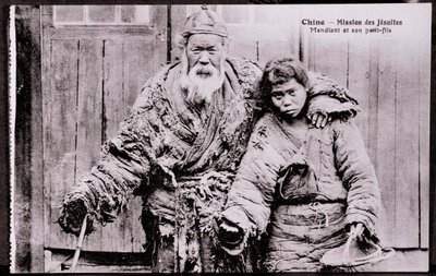 Vanha kerjäläinen pojanpojan kanssa Valokuva 1900-luvun alusta - Yksityiskokoelma tekijältä Anonymous Anonymous