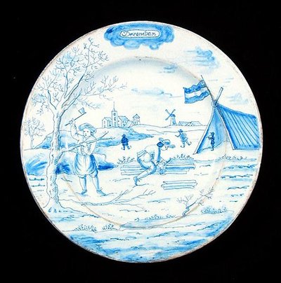 Joulukuuta esittävä Delftware-laatta (tinalasitettua saviastiaa). tekijältä Dutch School