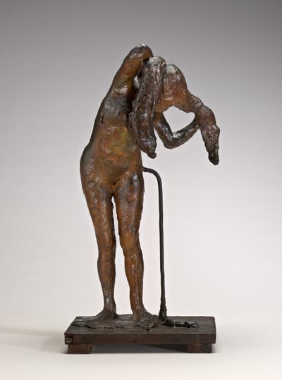 Nainen järjestämässä hiuksiaan, mahdollisesti 1880-1890-luvun lopulla. tekijältä Edgar Degas