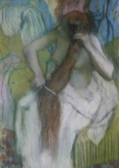 Nainen kampaa hiuksiaan tekijältä Edgar Degas