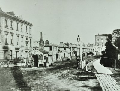 Kilburn Toll Gate Kilburn High Roadin eteläpäässä Kilburn Prioryn risteyksessä, Camden Libraries, 1875 tekijältä English Photographer